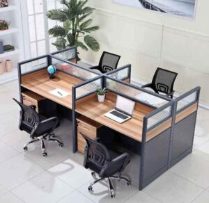 4-Way Office Workstation with Lockable Drawers 4-way workstation with lockable pedestal drawers in a modern office setup